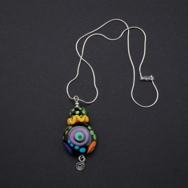 Ruffled Disk and Eye Pendant