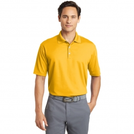 gold nike polo